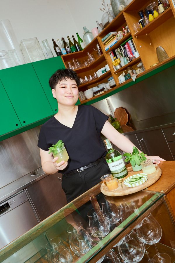 Drinks expert Judith Zhu holding the Apple Strawberry Eastside cocktail