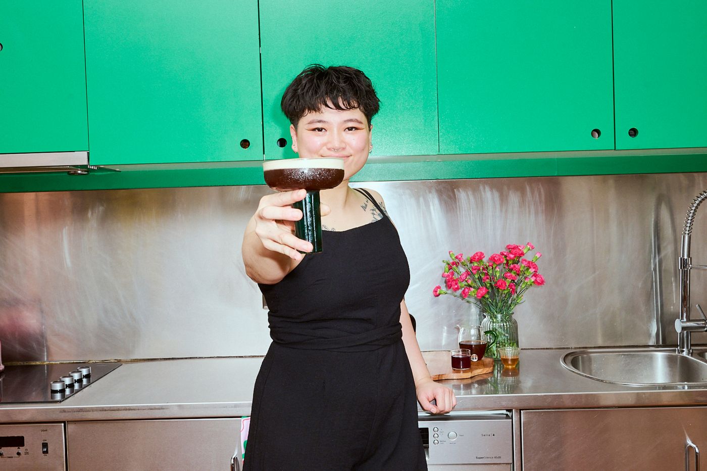 Sydney bartender Judith Zhu holding her Cherry Espresso Rumtini 