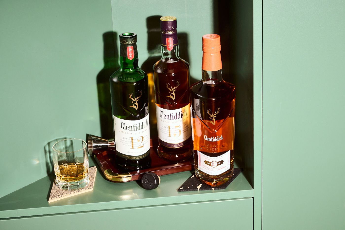 Various bottles of Glenfiddich Scotch whisky in a cabinet