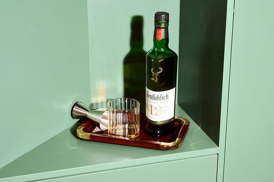 A.bottle of Glenfiddich 12 Year Old on a tray with a dram and jigger
