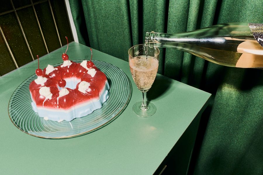 A retro jelly mould and a glass of moscato pouring into a glass