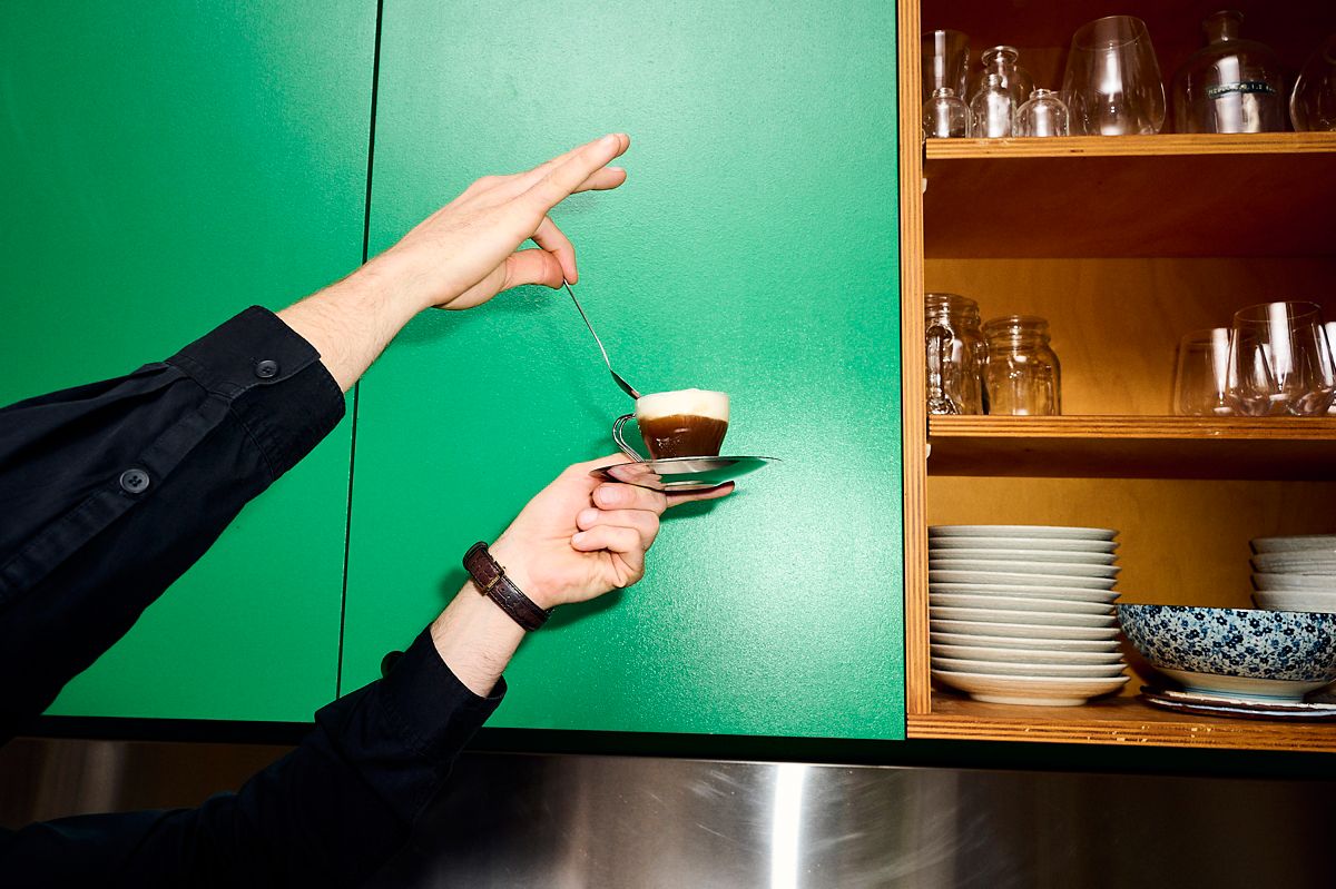 Holding the Blue Ribbon Old Fashioned up in a kitchen