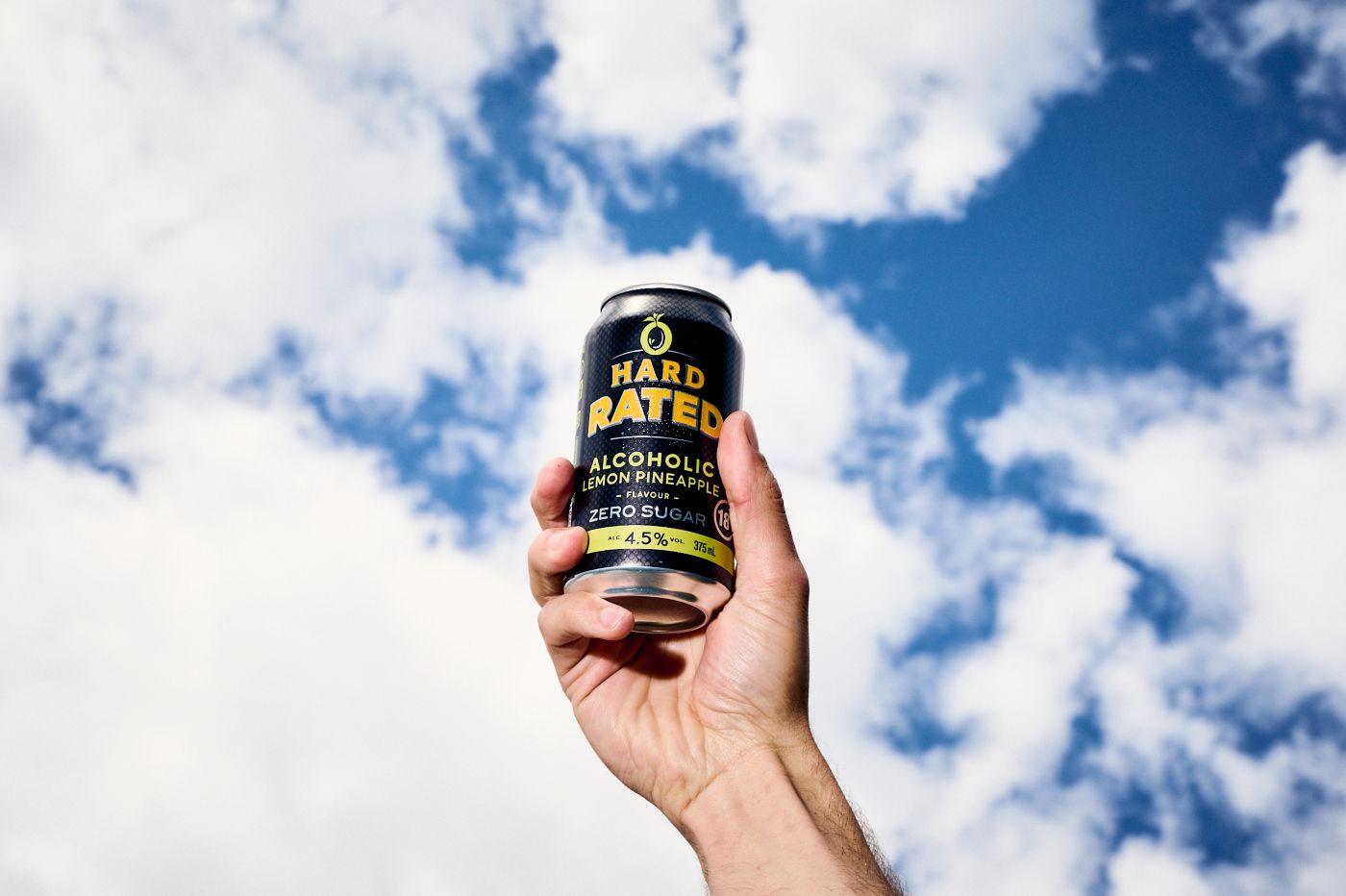 Holding a can of the new Hard rated Lemon Pineapple