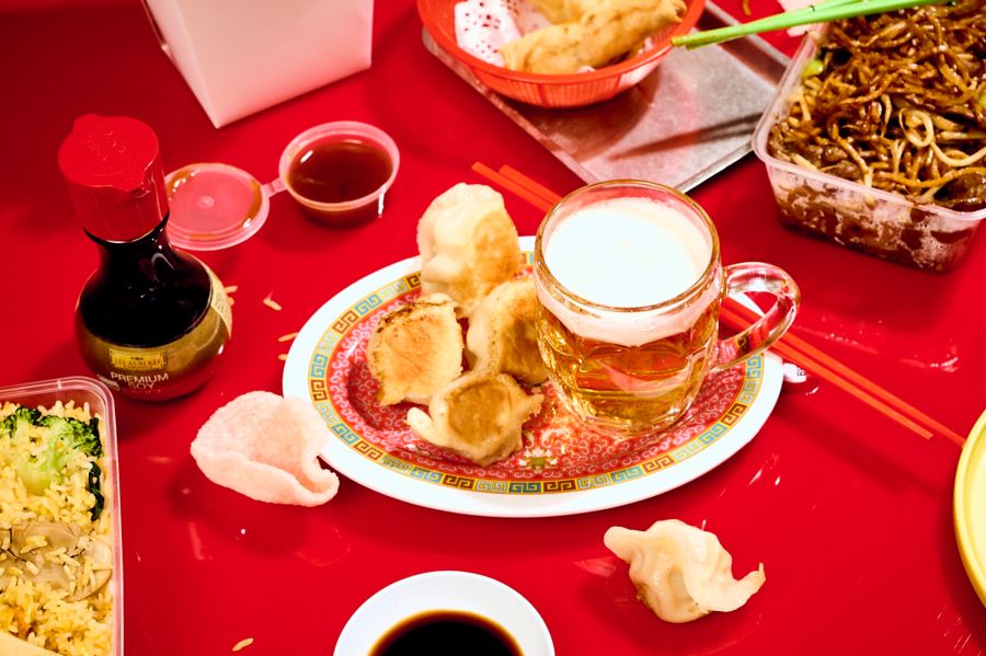 Dumplings on a table with a glass of beer