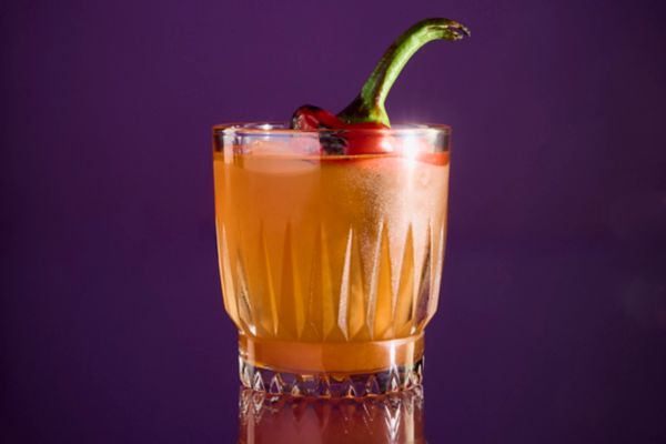  This fire-red cocktail is smoky, spicy and sweet – and perfect for Halloween (or anytime). 
