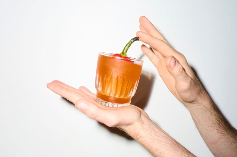 Holding the Diablo Rojo, or Red Devil – a cocktail designed for Halloween