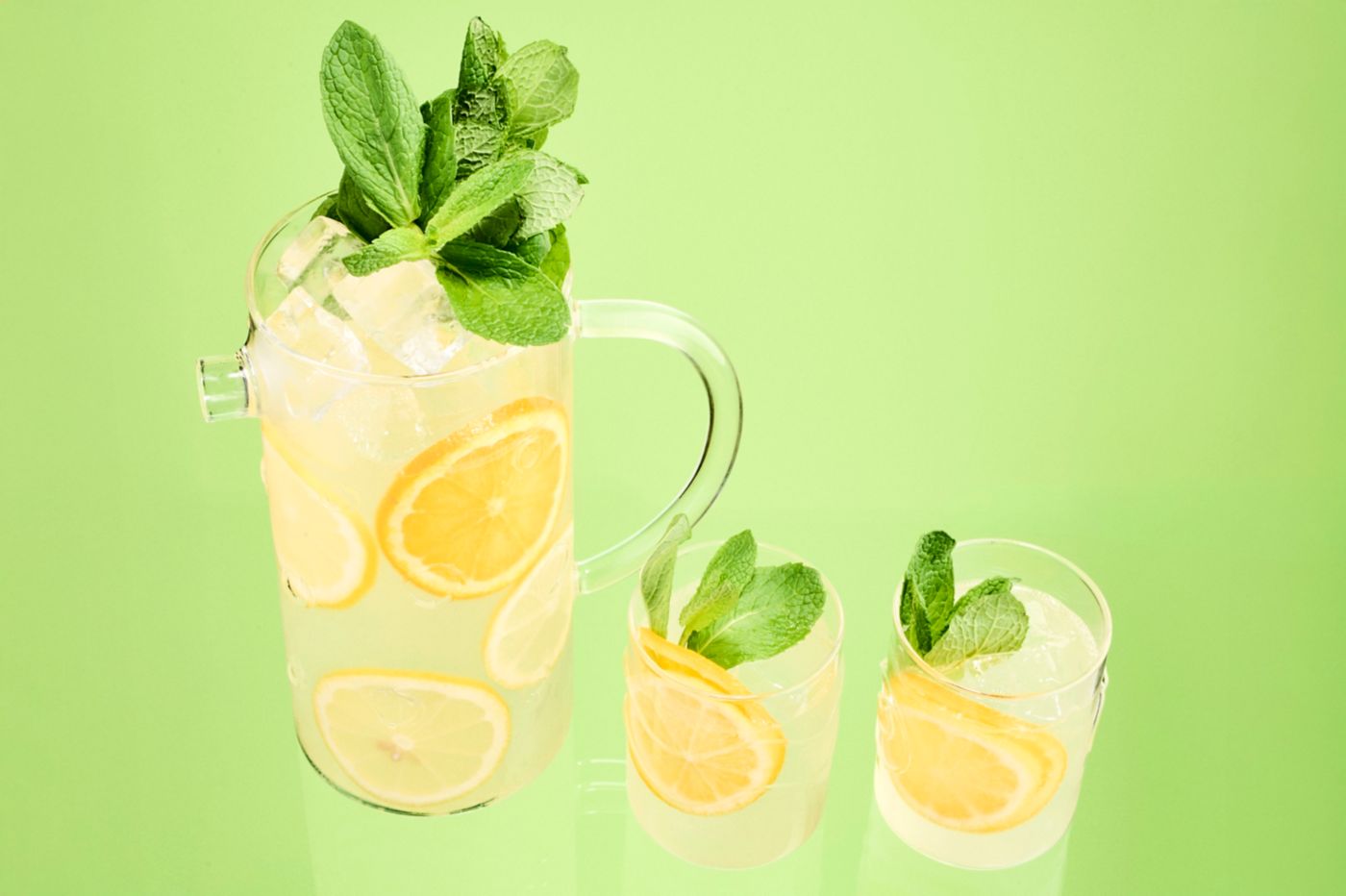A jug of the DIY Alcoholic Lemonade with two glass –&nbsp;perfect for summer