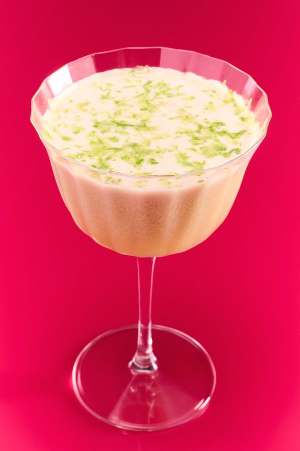 The creamy, sweet and spicy Hot Honey Coco Daiquiri against a pink background
