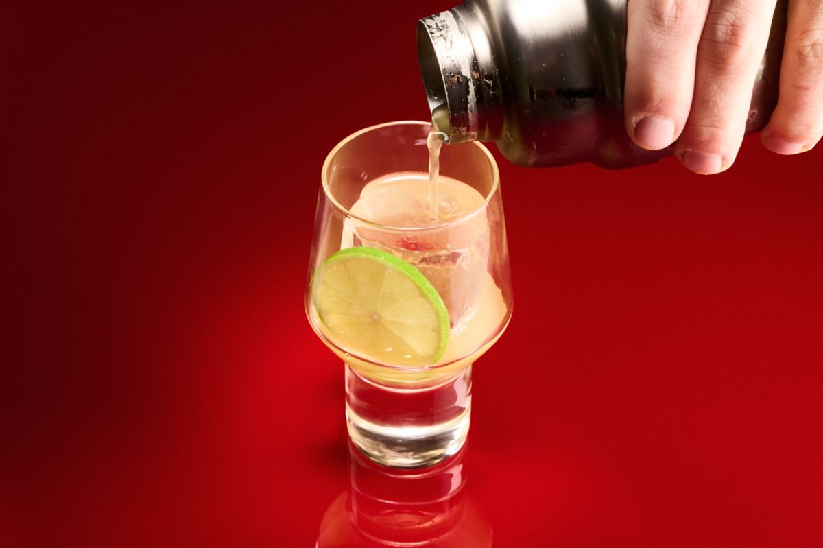 Pouring out the Italian Margarita, made from reposado tequila, orange juice and amaretto