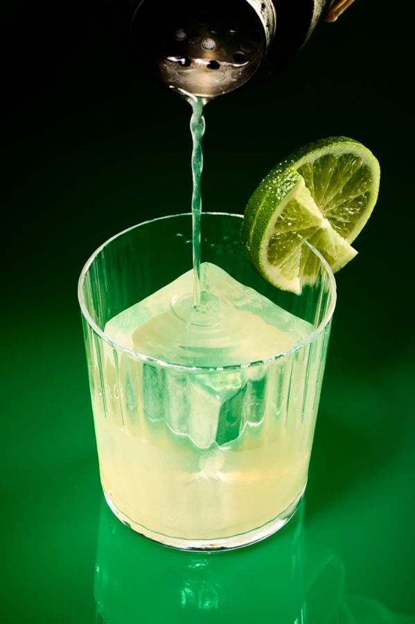 Pouring a Tommy's Margarita into the glass