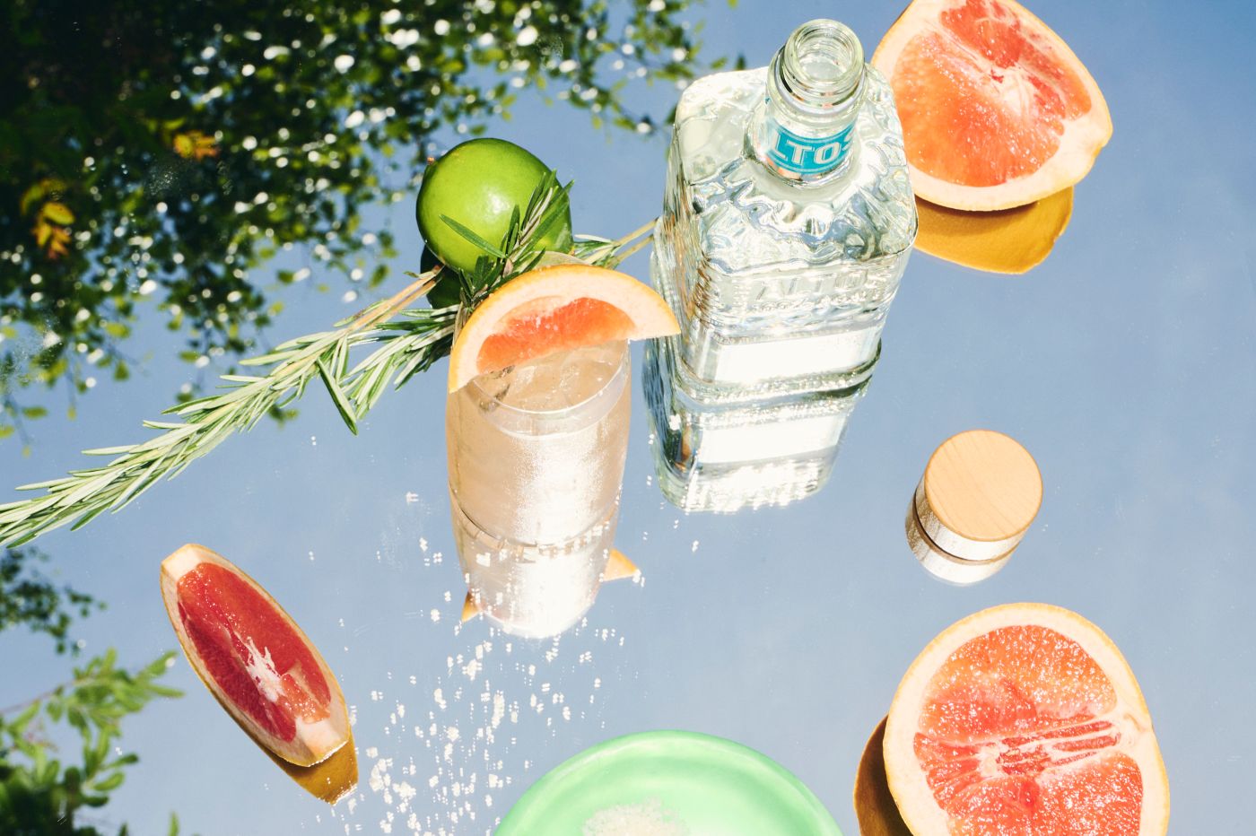 A bottle of Altos Tequila with citrus and salt 