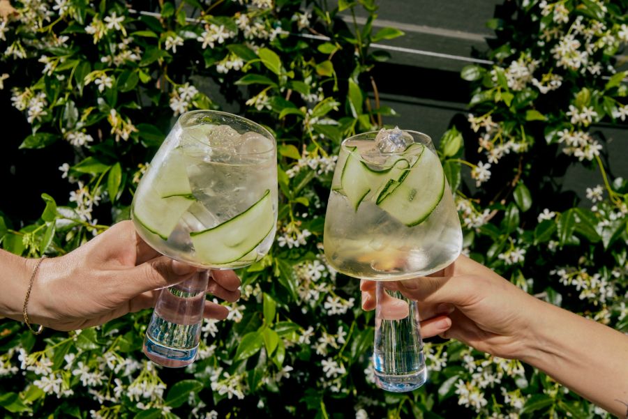 Two large glasses of Hendrick's Gin Spritz with cucumber garnishes